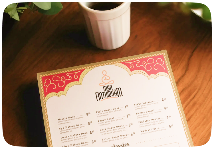 Maa Aathidyam printed menu on a restaurant table