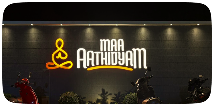 Maa Aathidyam restaurant signage at night